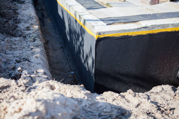 Professional Basement Waterproofing technician working in La Center, WA